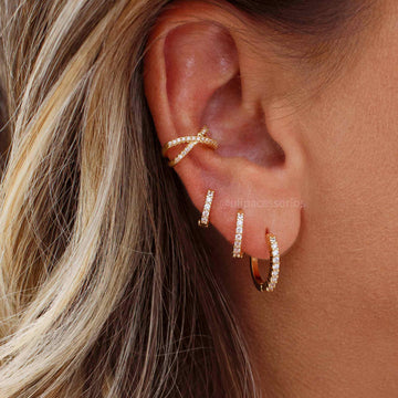 Piercing X cravejado com banho de ouro 18k