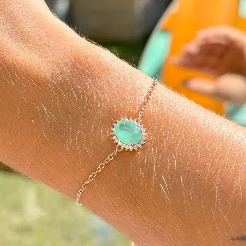 Pulseira oval esmeralda colombiana entorno cravejada dourada