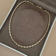 Colar riviera com detalhe x dourado e banho de ródio branco
