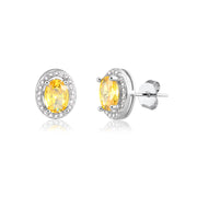 Brinco oval menor com zircônia citrino entorno cravejado com banho de ródio branco