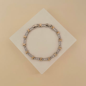 Pulseira riviera com detalhe em x dourado o banho de ródio branco
