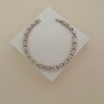 Pulseira riviera com detalhe em x dourado o banho de ródio branco