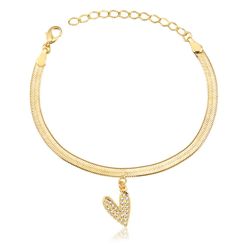 Pulseira fita laminada com pingente coração cravejado dourada
