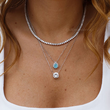 Conjunto gota princess com zircônia na cor água marina com banho de ródio branco