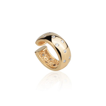 Piercing dourado largo com pontos de luz