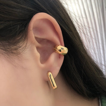 Piercing dourado largo liso